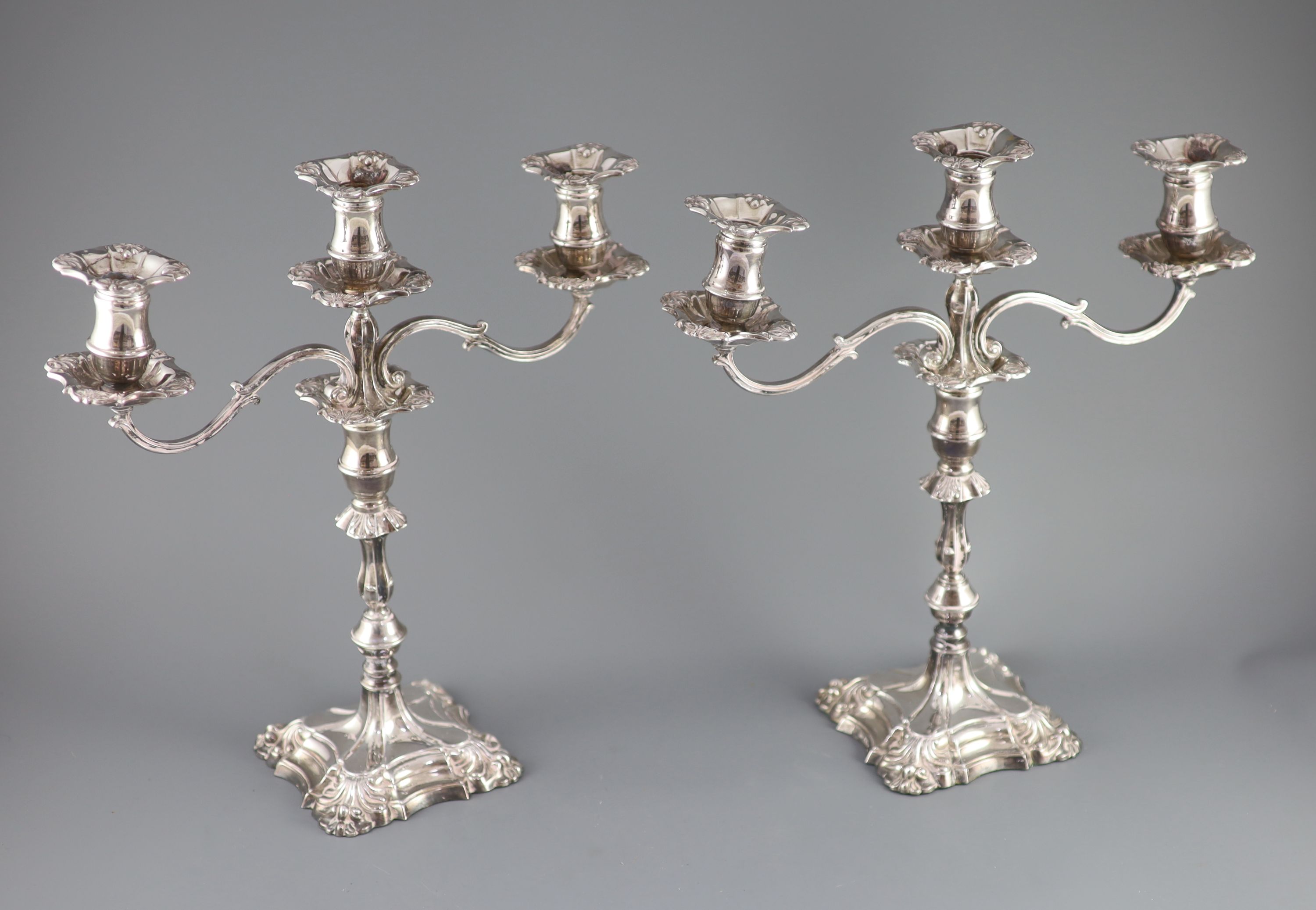 A modern pair of silver two branch, three light candelabra by Roberts & Belk